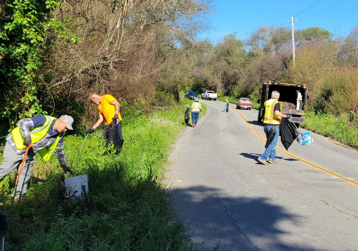 volunteers are cleaning the road